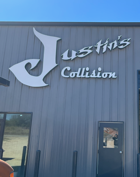 Dimensional metal letter building sign for Justin's Collision auto body shop