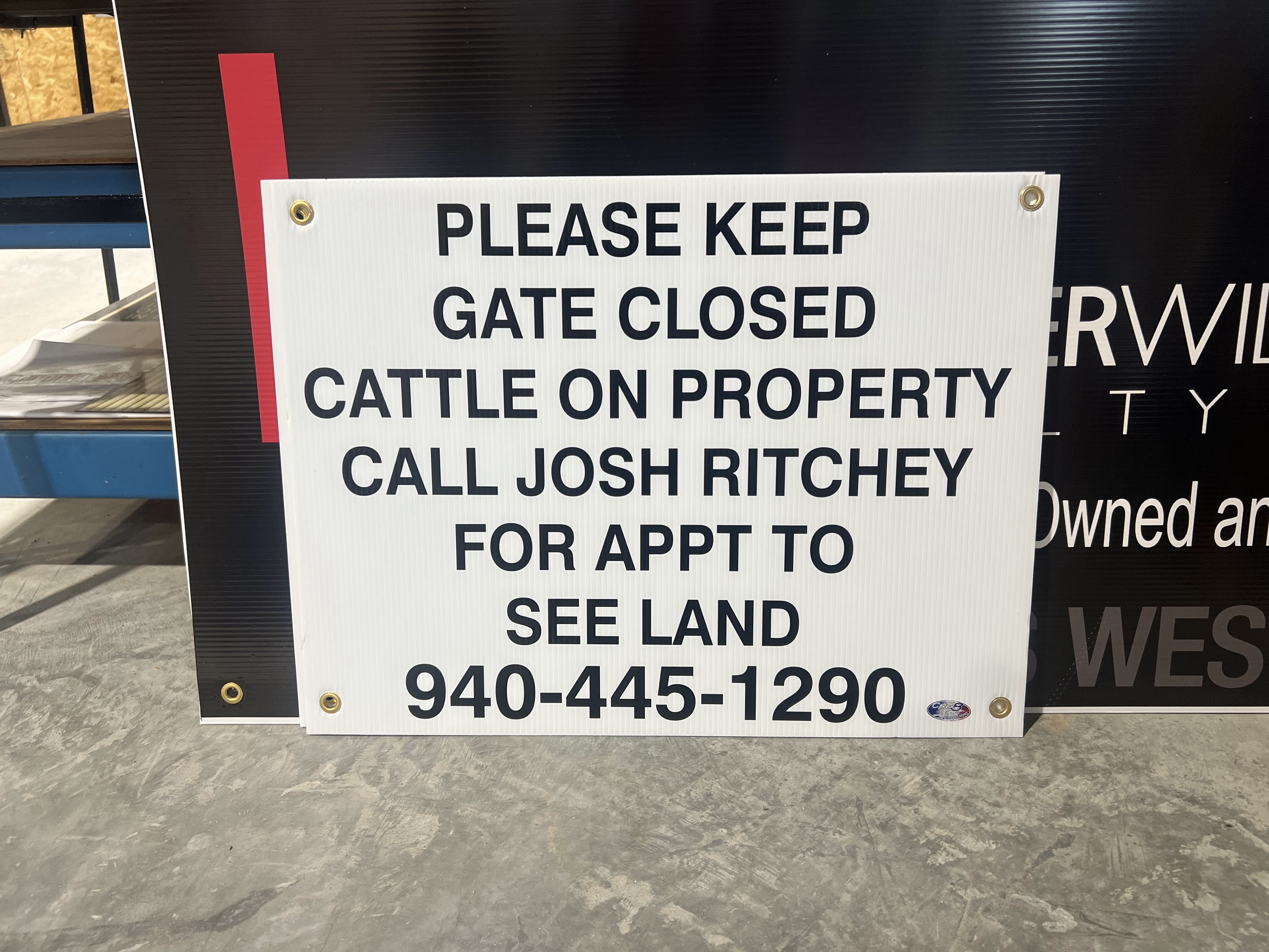 Corrugated plastic property sign with grommets for a Central Texas ranch gate