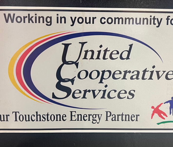 United Cooperative Services magnetic vehicle sign with logo for a Central Texas utility company